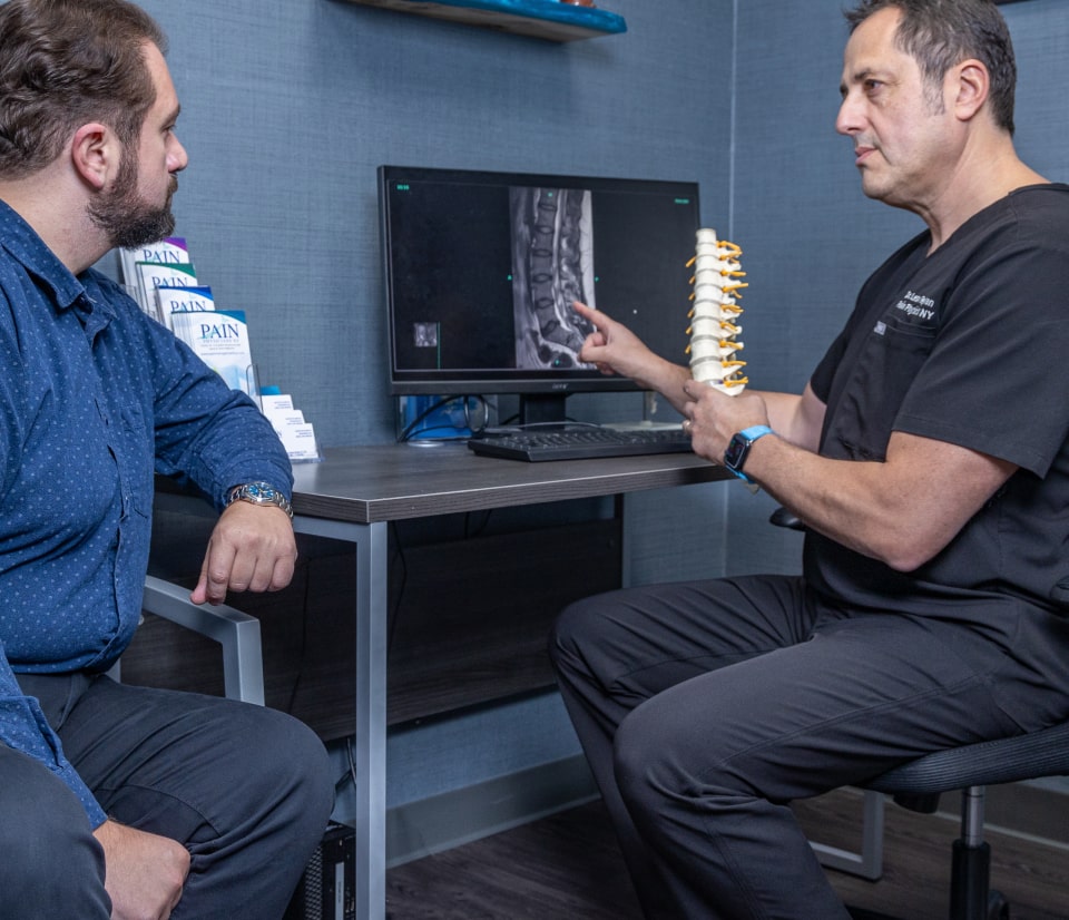 InterventionalPain Management Dr. Reyfman with the patient